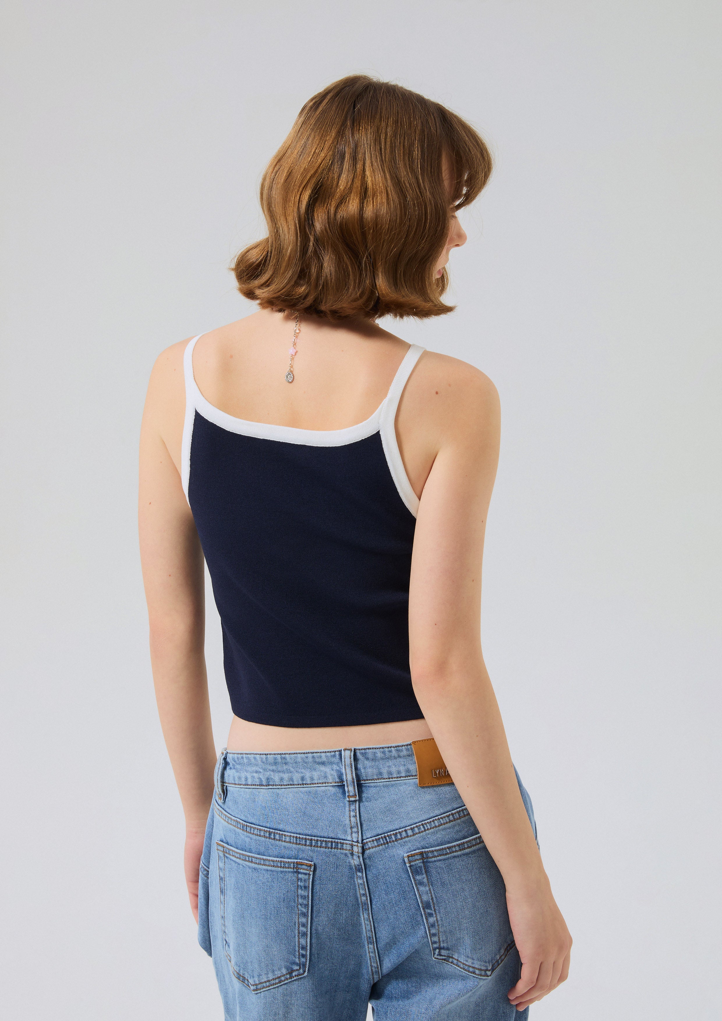 เสื้อครอปสายเดี่ยวปักโลโก้ คอลเลกชัน Speed Voyard