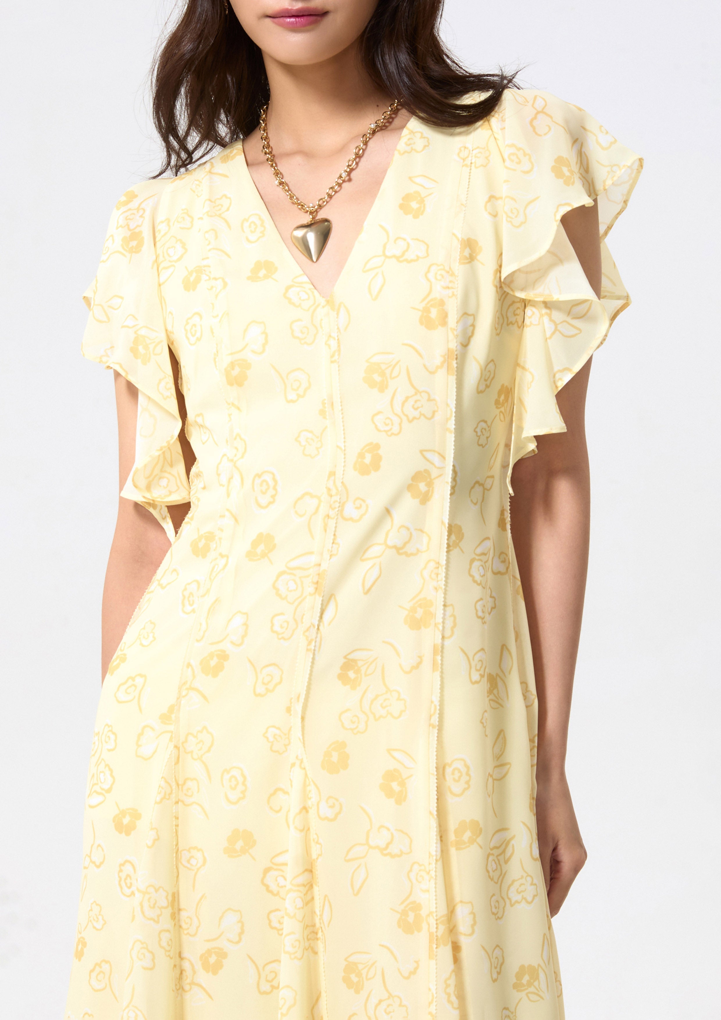 เดรสยาวพิมพ์ลายดอกไม้แขนสั้นผ้ารัฟเฟิล คอลเลกชัน Blossom Elegance