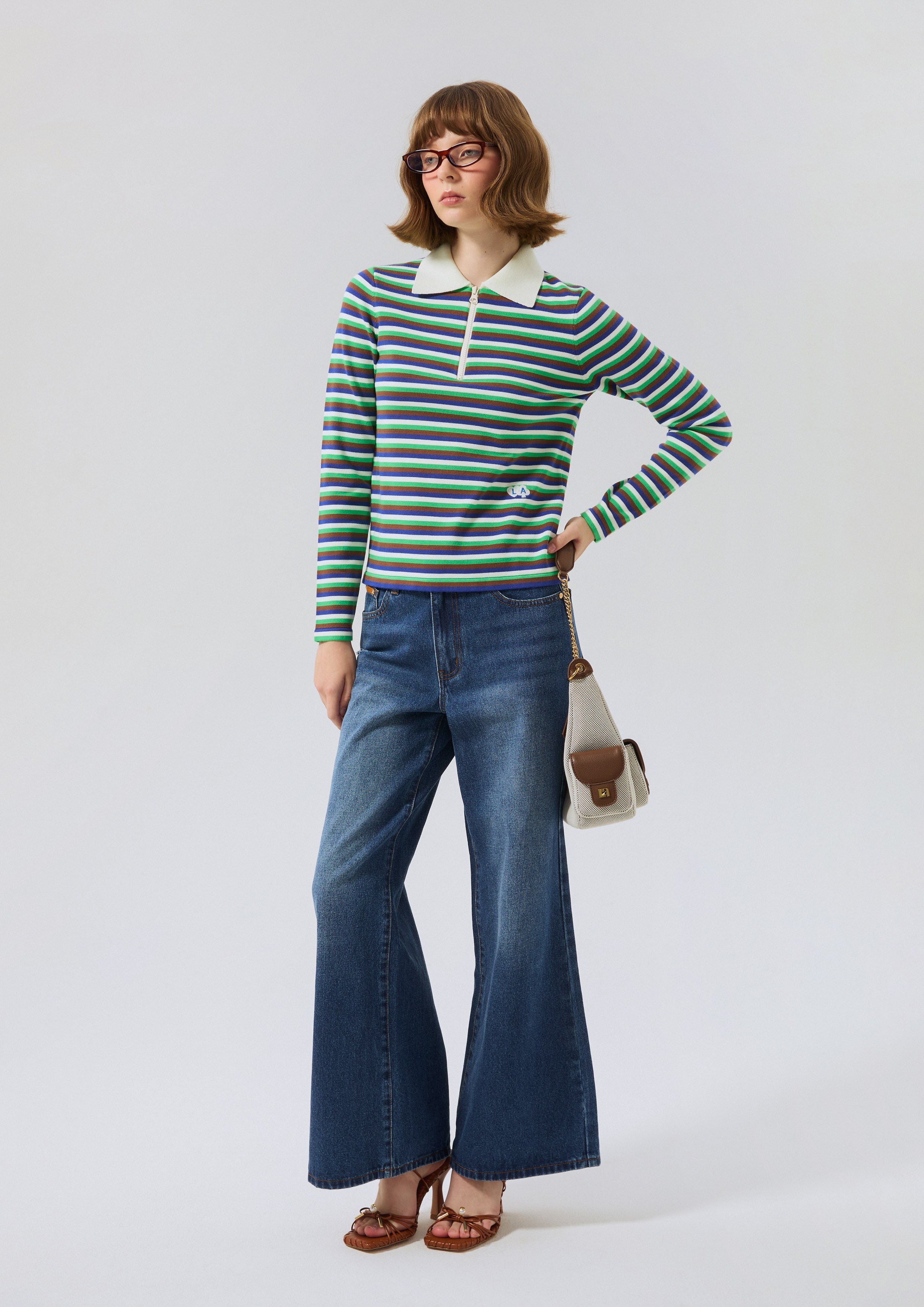 เสื้อแขนยาวลายทางพร้อมดีเทลโลโก้ คอลเลกชัน Miracle Voyard