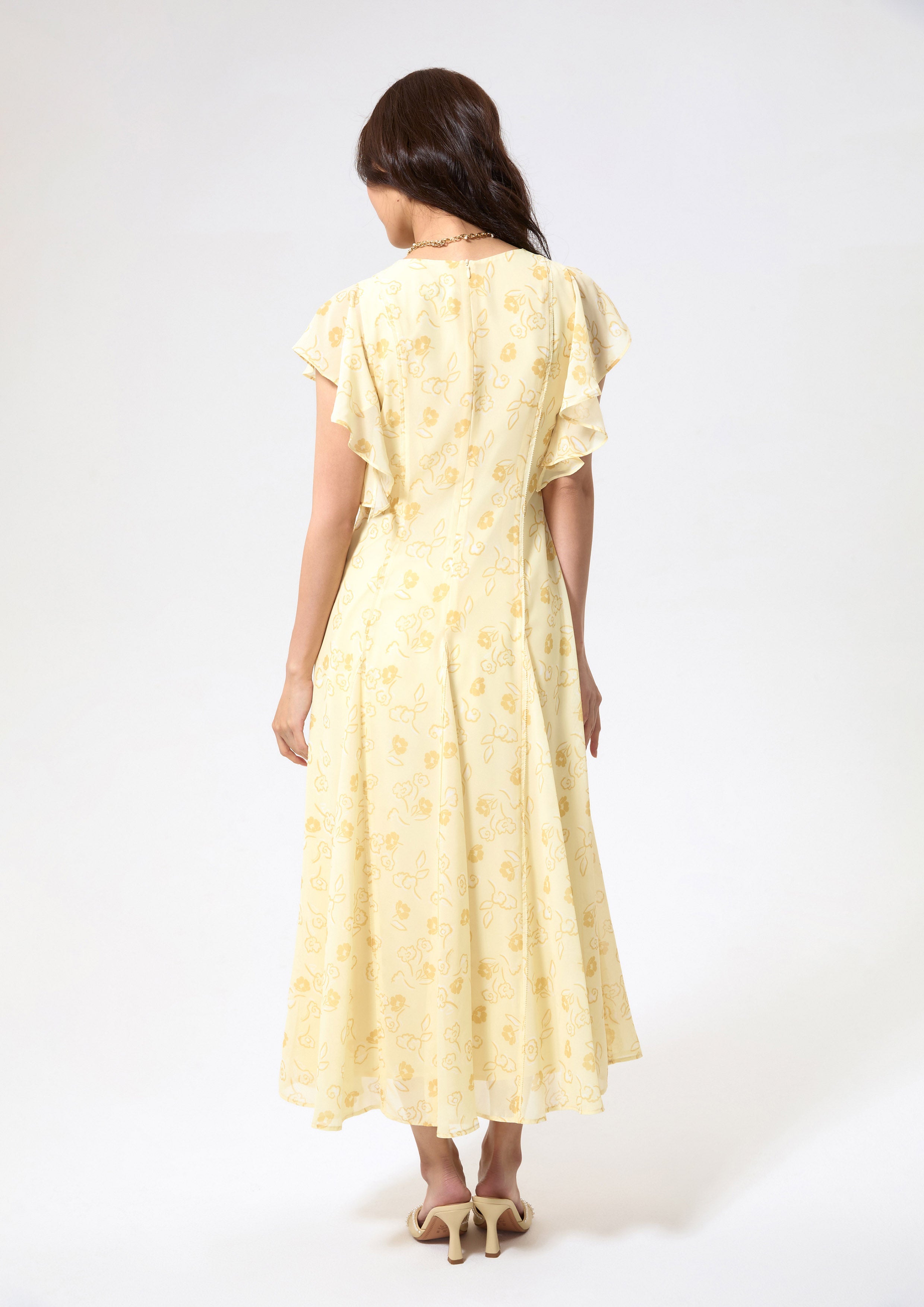 เดรสยาวพิมพ์ลายดอกไม้แขนสั้นผ้ารัฟเฟิล คอลเลกชัน Blossom Elegance